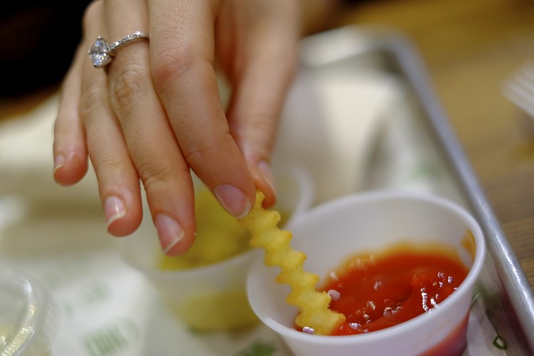 Fries dipped with ring finger